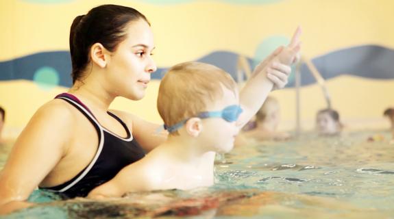 swim instructor with child