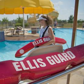 Rescue tube in front of pool