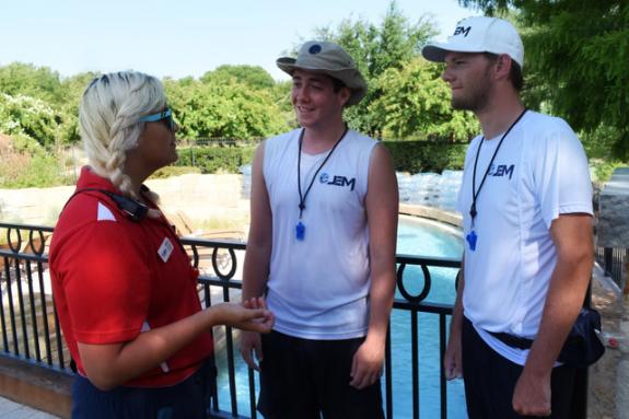 JEM lifeguard instructor talking with lifeguards